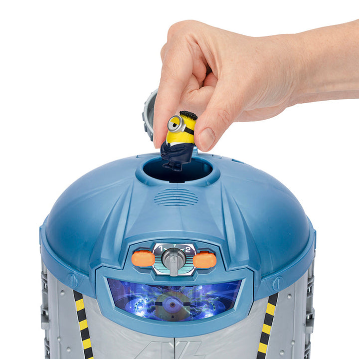 Hand placing Jerry figure into the Despicable Me 4 Transformation Chamber for fun playtime adventure.