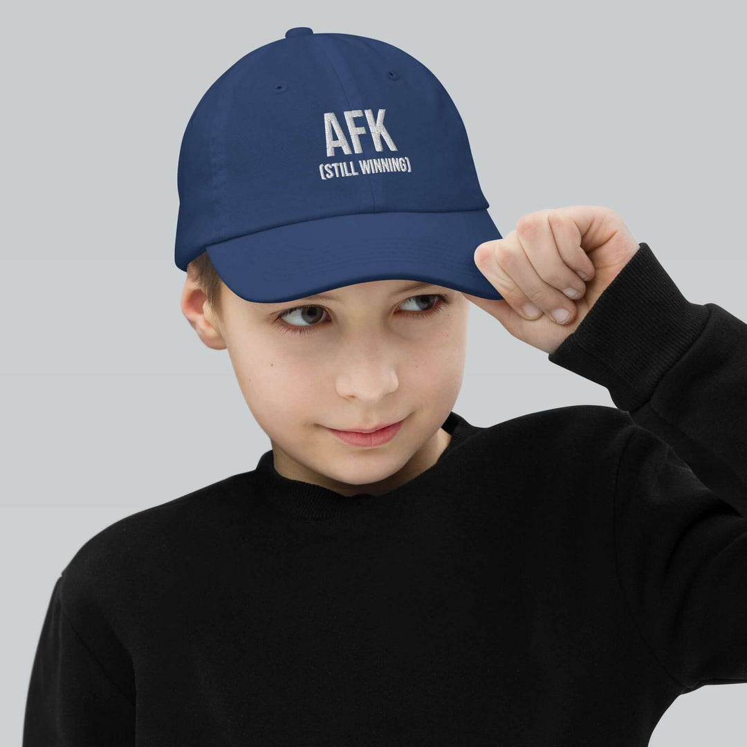 AFK Youth baseball cap worn by a child, featuring a stylish design and adjustable strap.