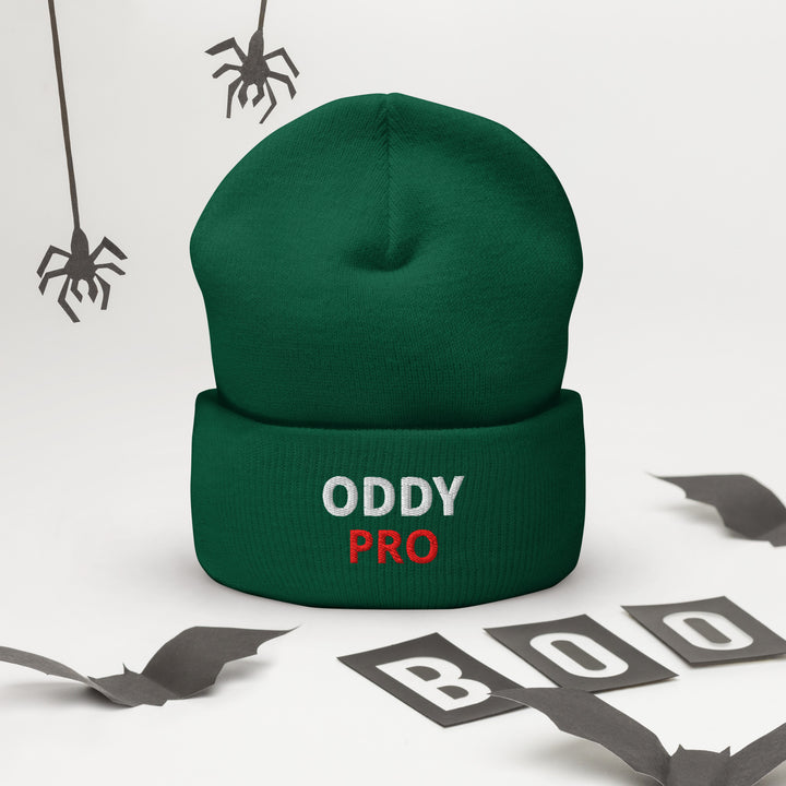 Oddy Pro Cuffed Beanie displayed on a white background with Halloween-themed decorations.