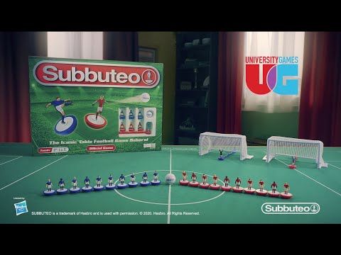 Subbuteo Champions League Main Game displayed on a table with players, goals, and the iconic game box.