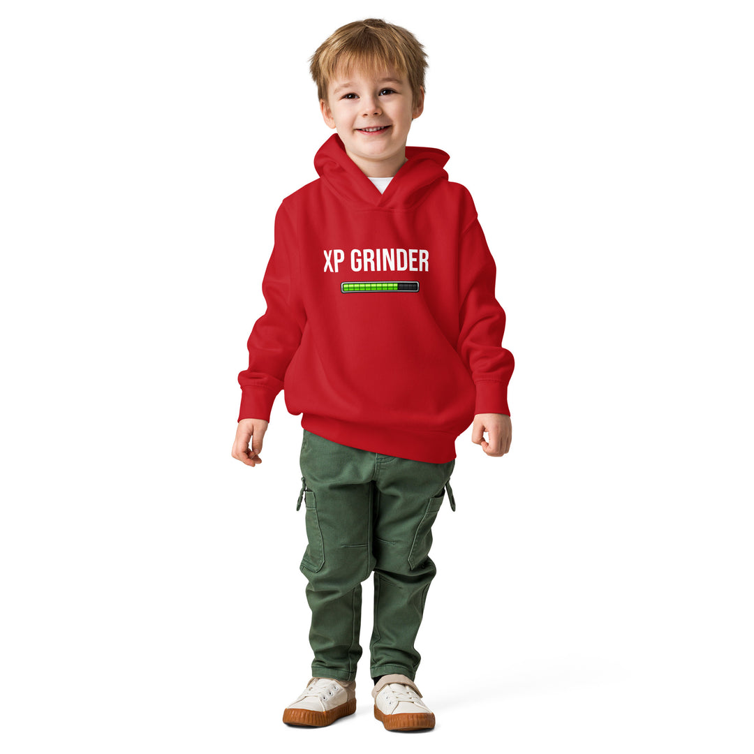 XP Grinder Toddler fleece pullover hoodie on a smiling child in a red hoodie and green pants.