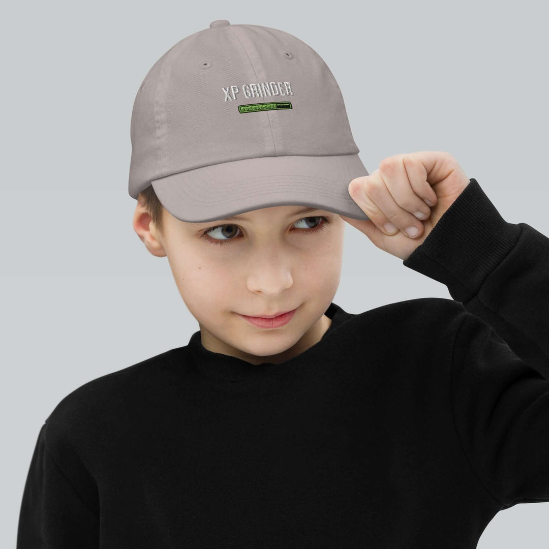 XP Grinder Youth baseball cap worn by a child, showcasing its stylish design and fit.