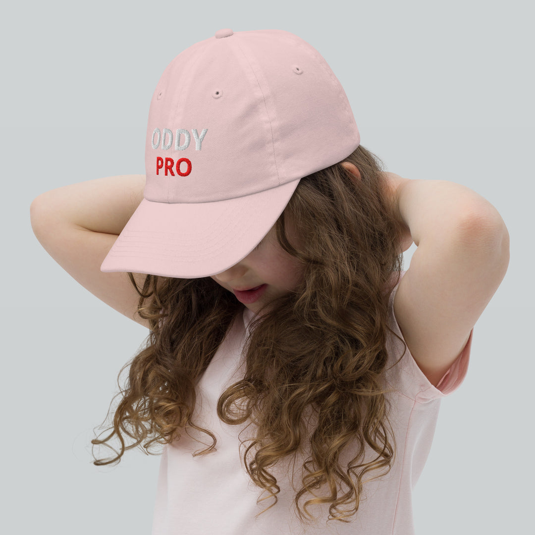 Oddy Pro Youth baseball cap worn by a child, featuring a stylish pink design and embroidered logo.